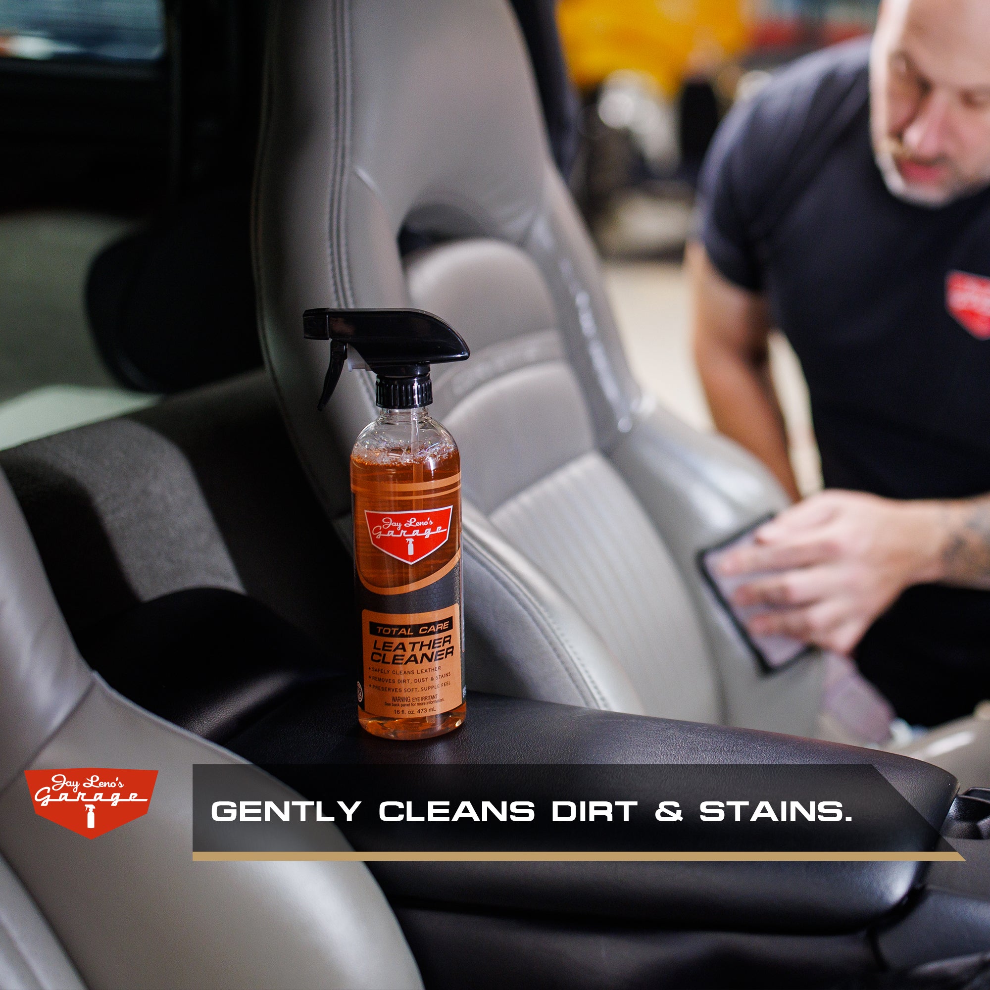 Jay Leno's Garage Leather Cleaner inside interior of car with person cleaning the seat